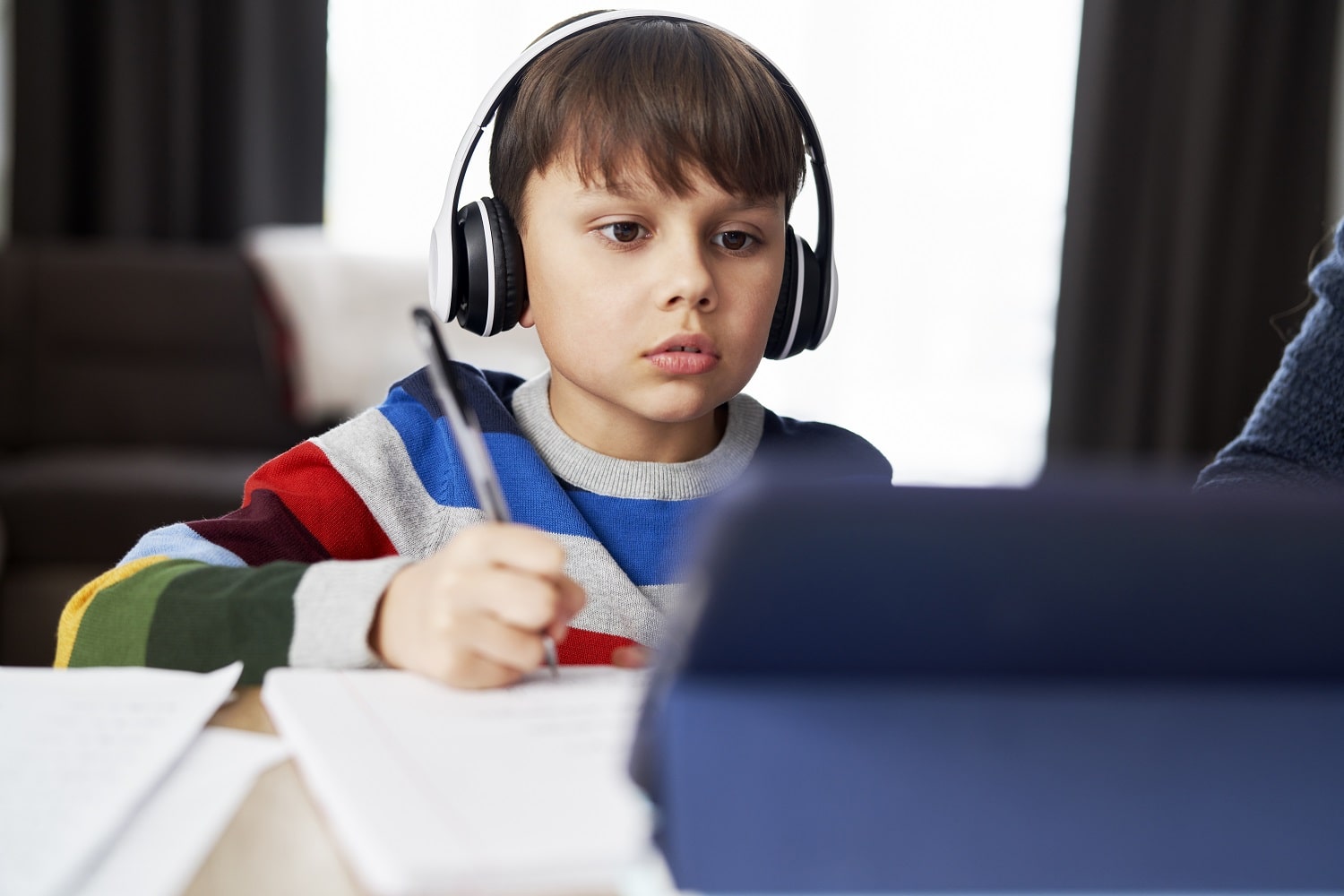 boy-in-headphone-during-homeschooling-2021-08-31-22-23-55-utc-min.jpg